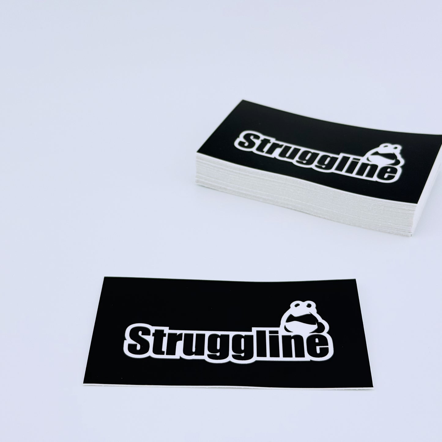 The original Struggline panda sticker on Black